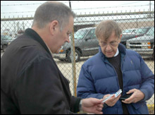 Fontenot (right) hands over his ID.