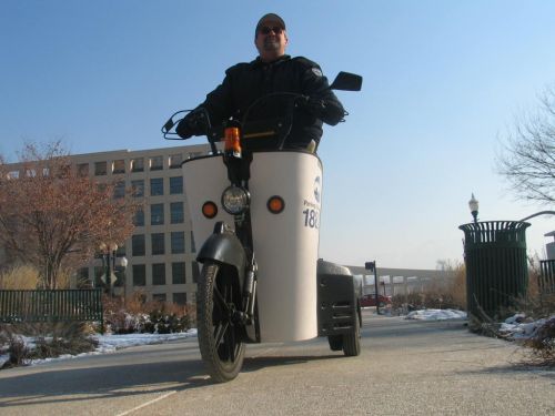 Three-wheeled parking chariot.