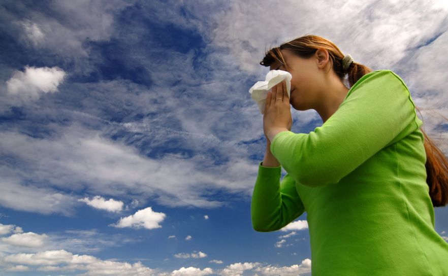 woman blowing nose