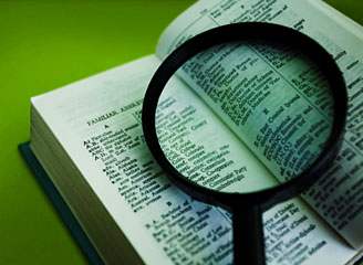 dictionary with magnifying glass