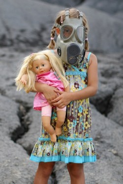 young girl in gas mask