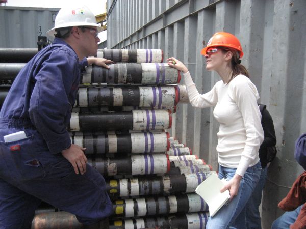 On board the rig, Little checks out sections of the drill shaft.