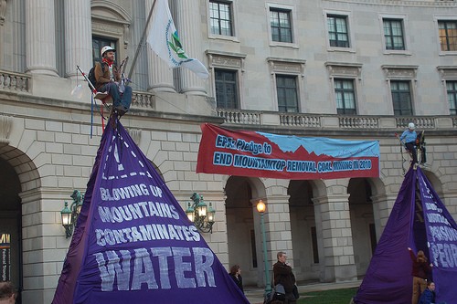 Protesters locked themselves to 20-foot purple mountains outside the EPA.