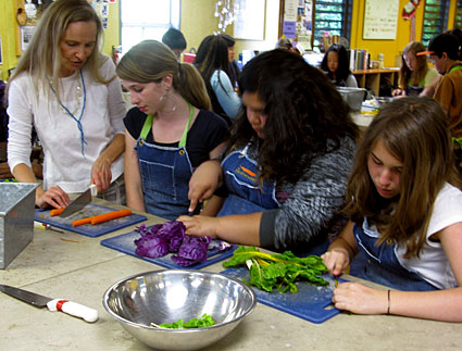 Kids prep vegetables