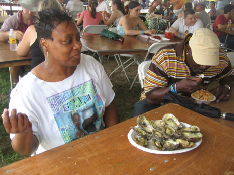 Lady eating at the festival.