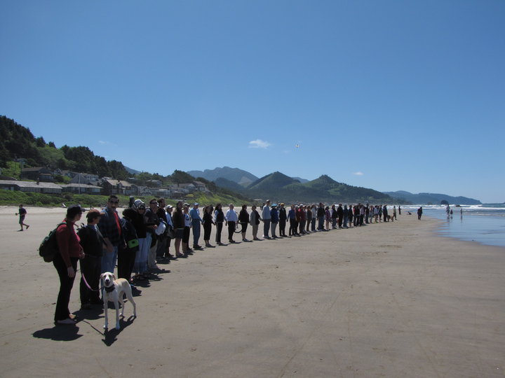 Hands across a beach. 