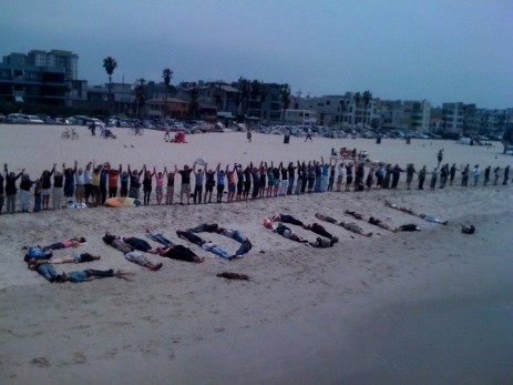 Hands across a beach.