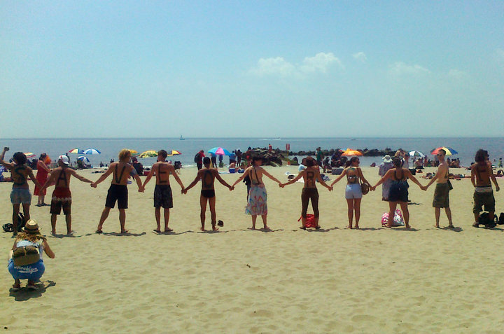 Hands across a beach.