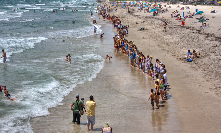 Hands across a beach.