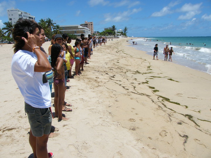 Hands across a beach.