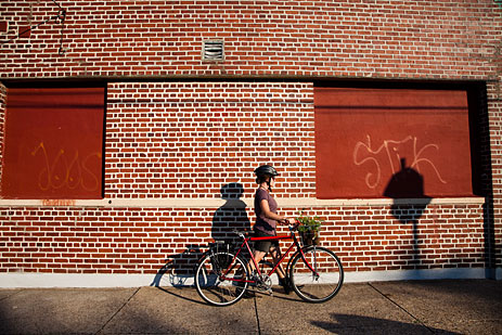 Girl on bike with produce