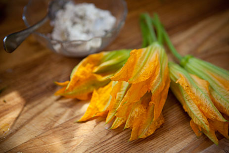 Squash blossoms on cutting board