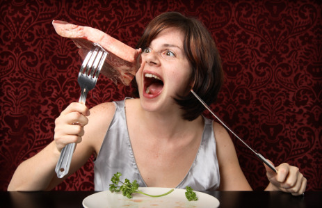 Girl attacking steak