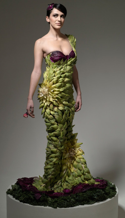 Woman wearing a dress made out of artichokes.