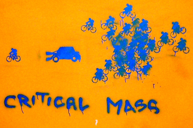 Critical Mass bikes chasing car-eating bike