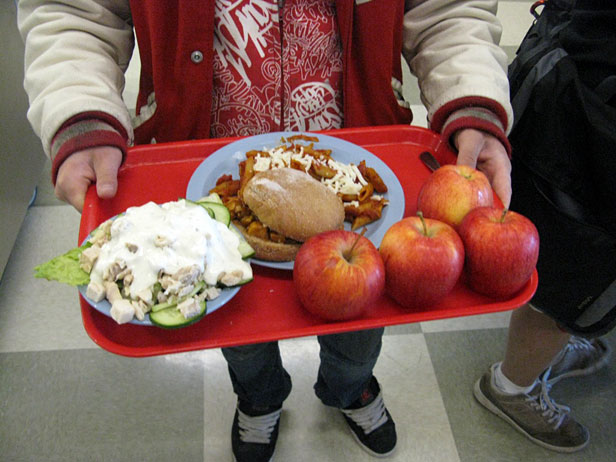 Kid with loaded tray