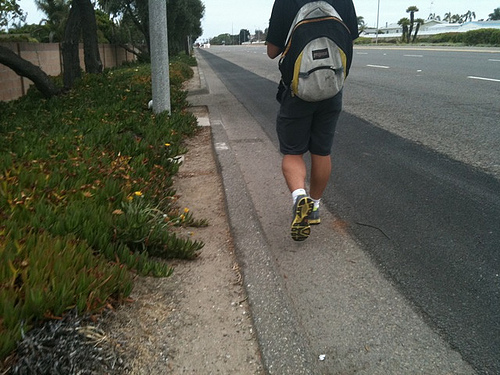 Man walking in gutter.