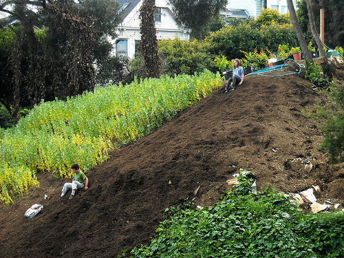 Kids sliding on dirt