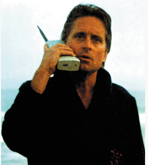 Michael Douglas on huge cell phone in "Wall Street"