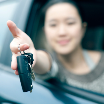 Woman handing over keys.