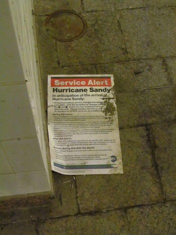 A service alert issued before the storm lies on the empty platform