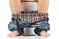 man-sitting-on-toilet