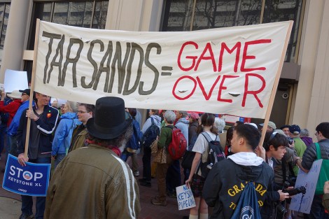 protest sign: "Tar sands = game over"