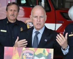 Jerry Brown addressing journalists on Monday.