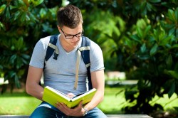 man reading green book