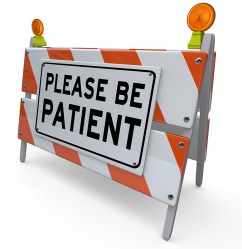 "please be patient" sign