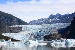 The Mendenhall Glacier's sudden surges of icy water threaten people and property in nearby Juneau.