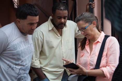 Eve Mosher talks to a couple of curious onlookers during HighWaterLine Miami.