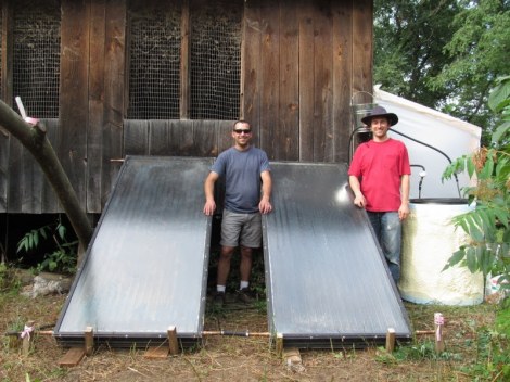 To sanitize urine before application, it is either stored for 30 days in a sealed tank in a room-temperature greenhouse (background), or heated for 30 minutes in a solar pasteurizer (foreground).