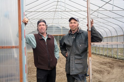 Scott and Joe in front of their greenhouse on Vashon Island.