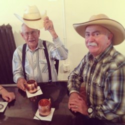 Grandfather and father. Similar hats; very different jobs. 