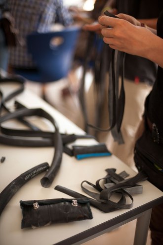 Making bracelets from bike tubes.