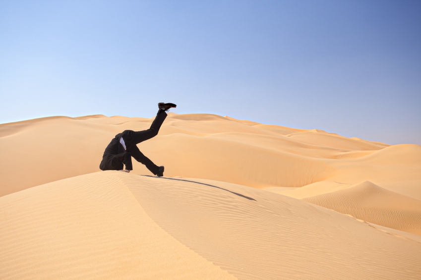 man with head in sand