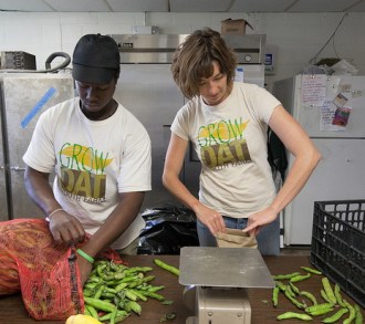 Johanna Gilligan packs fava beans with a student from the Grow Dat program in New Orleans.