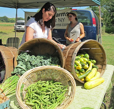 woman selling at farmers market