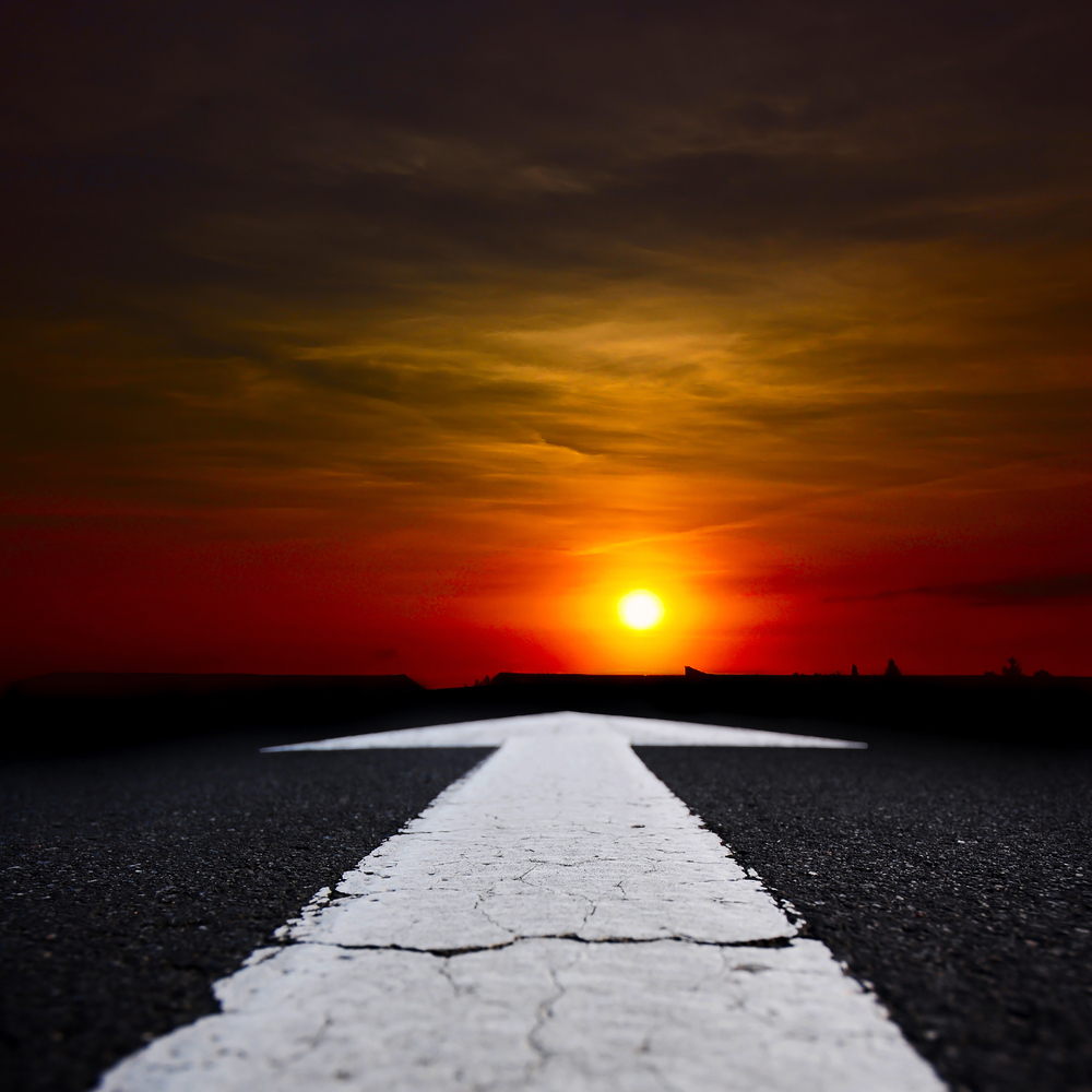 road leading into sunset