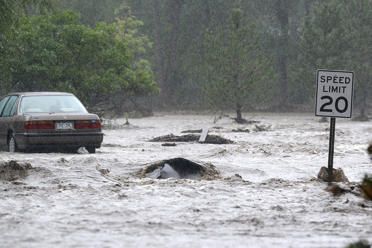 car on flooded road