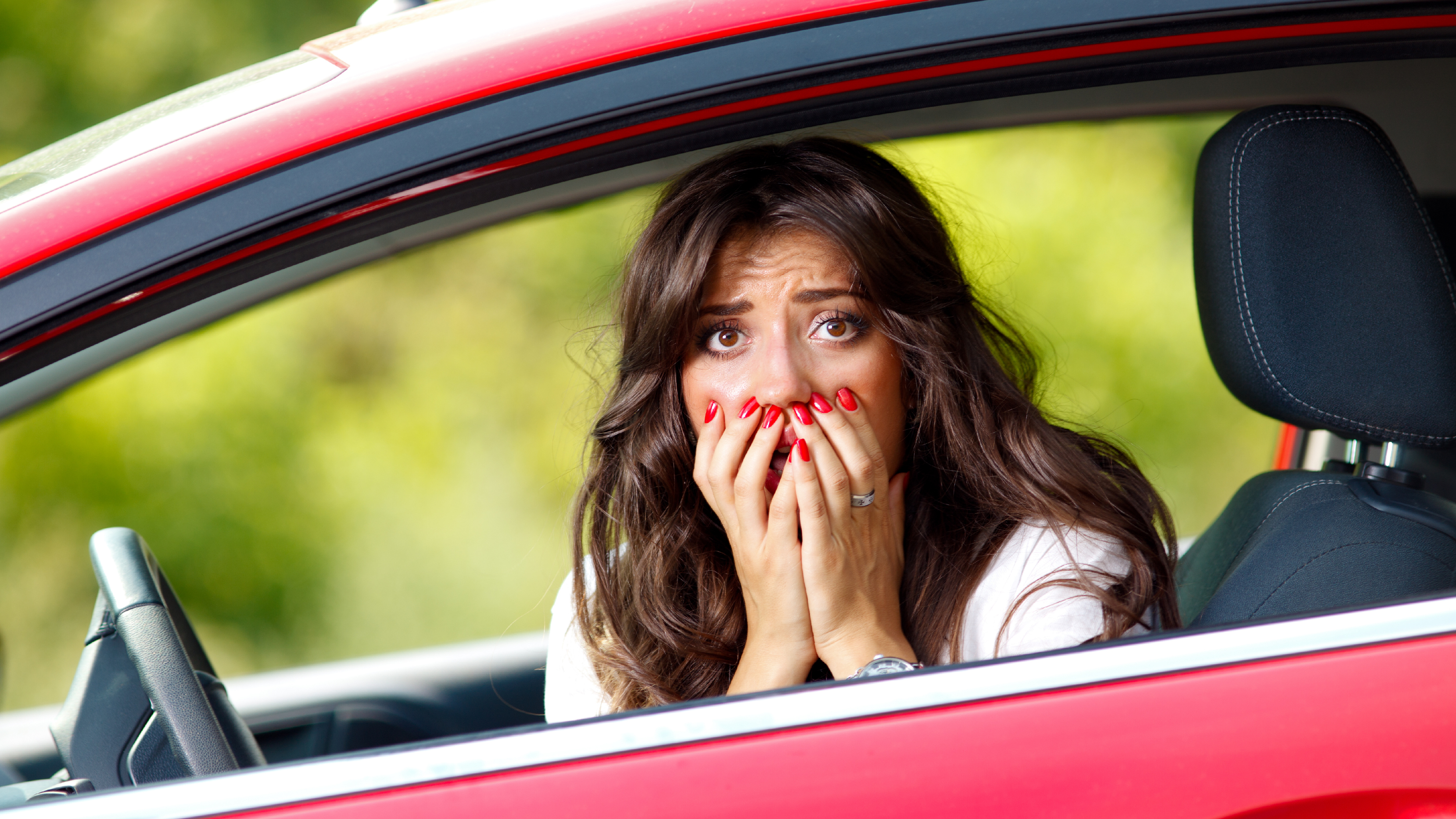 alarmed woman in car