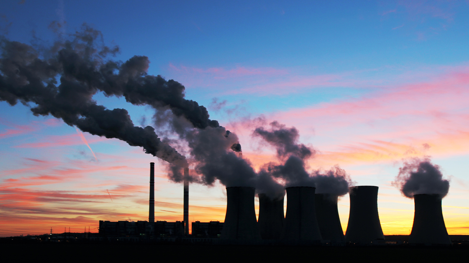 coal plant in a sunset