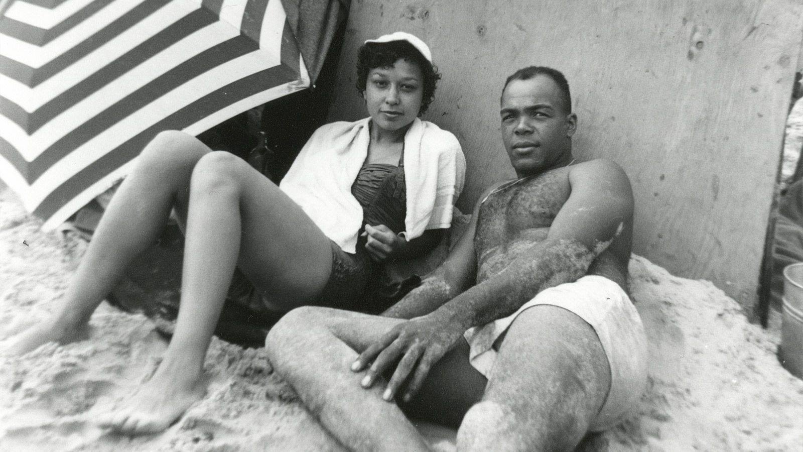 An unidentified couple lounging on Bay Shore Beach, outside Hampton, Virginia.