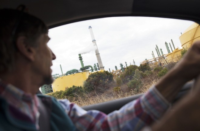 Ed Ruszel drives by the Valero Refinery, which is about a mile from his family’s woodworking business in Benicia, CA.