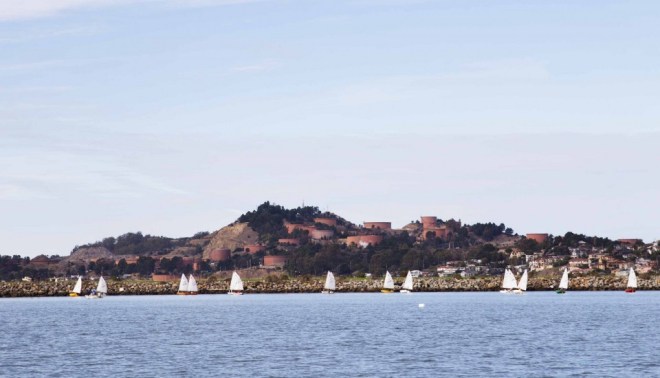 Oil storage tanks used by the Chevron refinery in Richmond, CA are seen from the water’s edge. A fire at the refinery in 2012 caused thousands of nearby residents to seek medical treatment. 