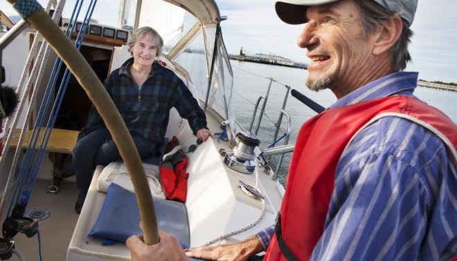 Ed Ruszel and Marilyn Bardet, an activist with Benicians for a Safe and Healthy Community, sail outside of the Richmond Harbor to investigate the presence of the oil industry along the Bay Area’s shoreline. 