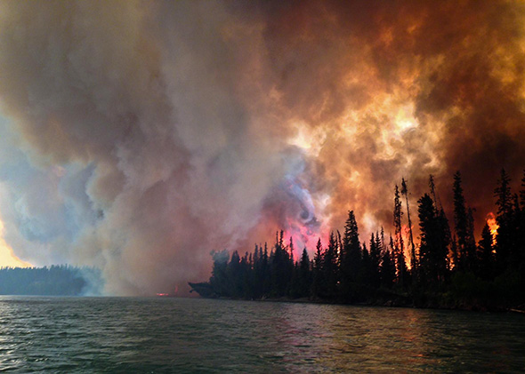 Fire burns at the Funny River area in the Kenai-Kodiak Area forest on May 25, 2014. 