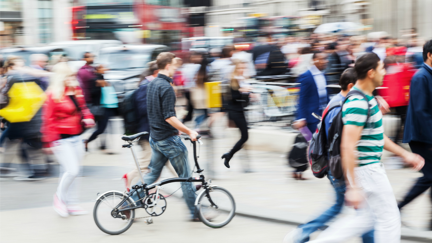 busy streetscape with walkers and bikers