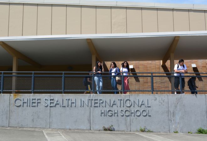 Three students (not interviewed for this story) spending their lunch period outside.